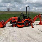 Mini Kubota with front and backhoe loader